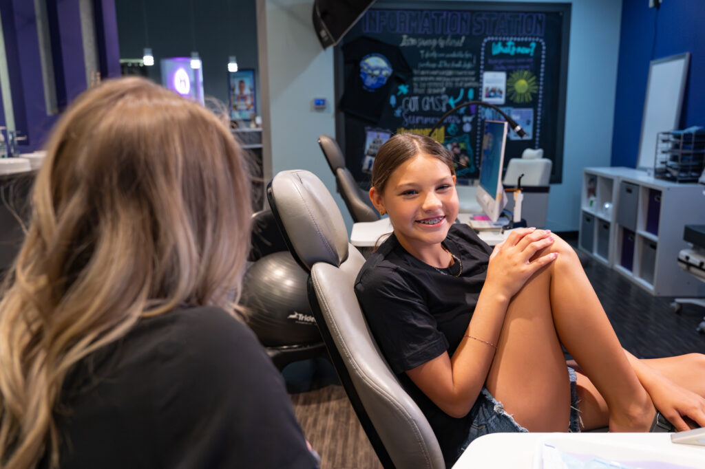 Patient with braces smiling at Icon Orthodontics